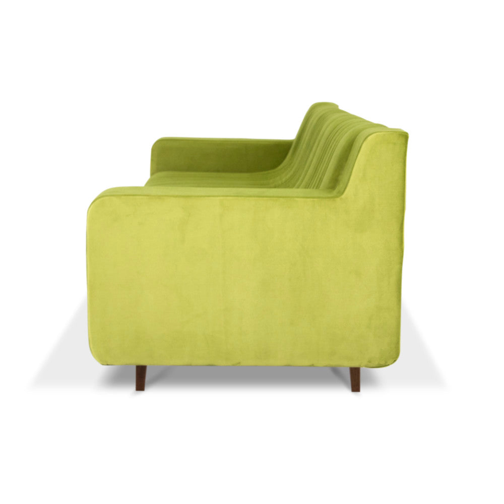 Introducing the Green Sofa by Tooba Furniture Factory—a modern three-seater in a vibrant lime green shade. This sofa features vertical seam detailing, wooden legs, wide armrests, and plush, upholstered fabric. Its sleek design effortlessly blends contemporary style with ultimate comfort.