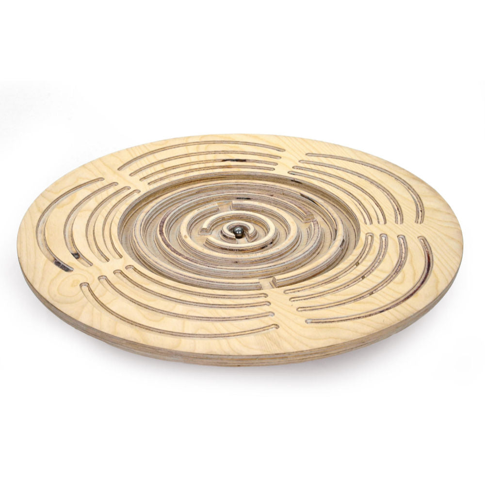 Introducing the Circular Labyrinth Balance Board by Tooba Furniture Factory: a meticulously crafted round wooden game featuring concentric paths and intricate passages carved into its surface. It includes a small metal ball that players must navigate through the maze by tilting and maneuvering, much like a delicate balance board.