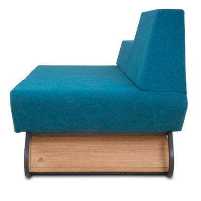 The Trapezoidal Sofa by Tooba Furniture Factory is a modern blue piece with angular backrests, sleek metal legs, and a wooden storage drawer underneath, set against a plain white background.