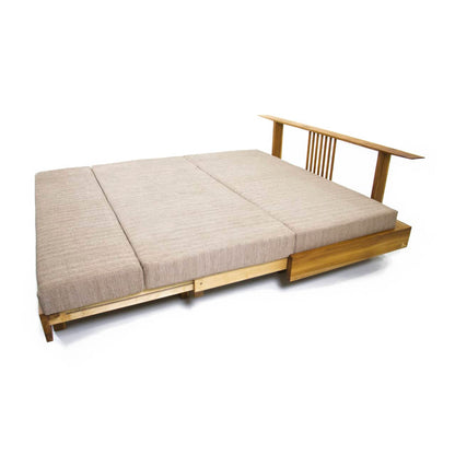 Introducing the Sofa Cum Bed Sliding-Teak Wood by Tooba Furniture Factory, a modern and understated beige sofa. This minimalist design boasts a teak wood base with raised legs and features a cushioned backrest and seating area upholstered in high-quality, light-textured fabric. It seamlessly doubles as both a comfortable sofa and a practical bed.