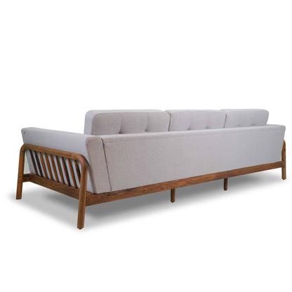 The Round Edge Sofa by Tooba Furniture Factory is a modern piece featuring light gray upholstery and a wooden frame. It includes three back cushions and showcases a minimalist design with wooden slats on the sides and back, making it perfect for contemporary living spaces.