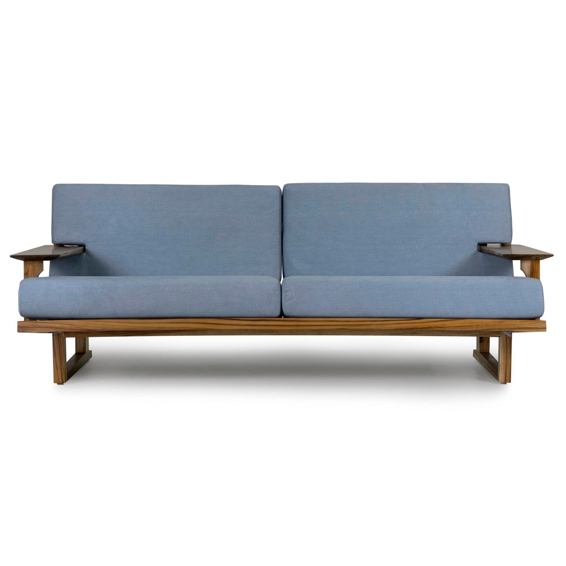 The Spoke Wooden Sofa by Tooba Furniture Factory is a modern mid-century style wooden piece with a minimalist design. It features light-blue fabric cushions and angled armrests, complemented by a sleek wooden frame with a natural finish. This exquisite sofa comfortably seats three and has a slightly reclined backrest for added comfort.